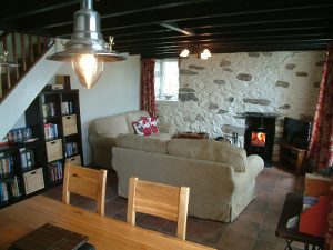 View of the lounge with log burner and dining room Gors-lwyd Cottage Llithfaen Llyn Peninsula