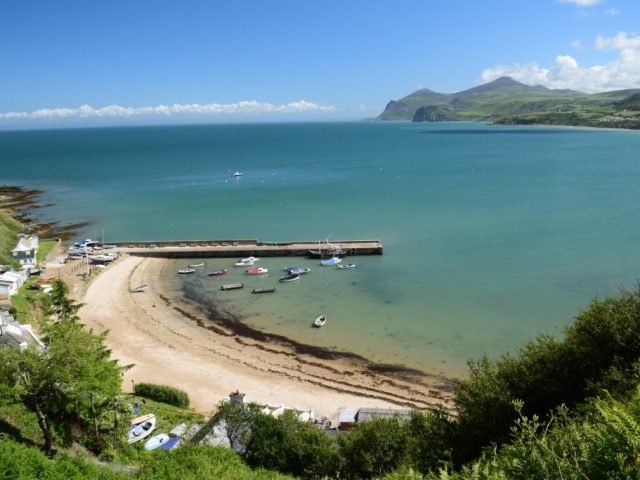 A view of the beach and harbour of Nefyn taken from the wales coastal path
