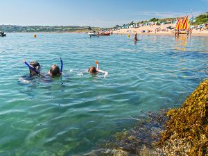 Children snorkelling in the sea at Abersoch Llyn Peninsula North Wales