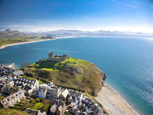 Aerial shot of Criccieth Castle and beach Llyn Peninsula North Wales