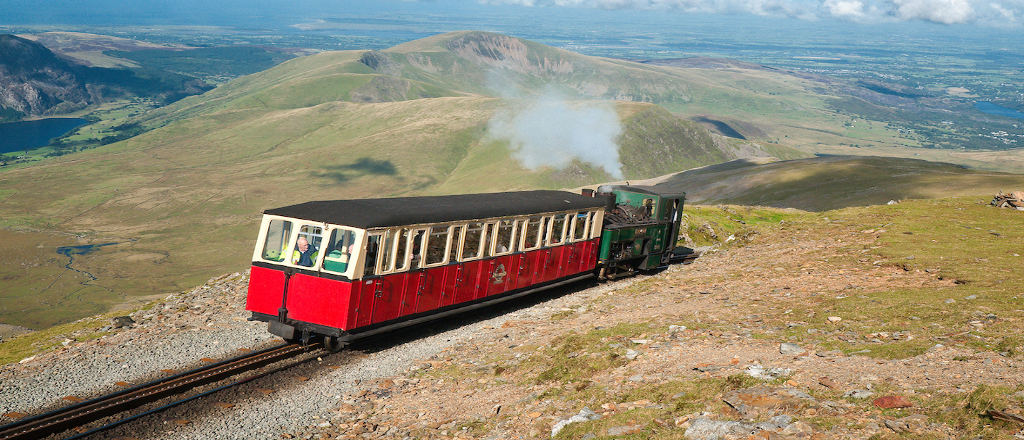 A view of a steam train to the summit of Mount Snowdon narow gauge railway