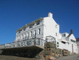 View of Ty Newydd pub and hotel by the beach at Aberdaron