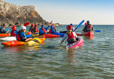 Children enjoying a kayak taster session North Wales Llyn Peninsula