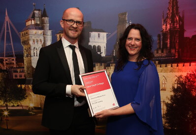 Collecting the award for best self catering in north wales from Welsh Government Director of Culture, Sport and Tourism, Jason Thomas.