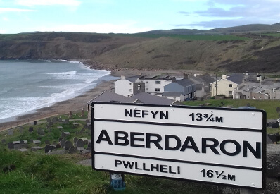 View of Aberdaron village including road sign.