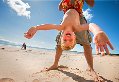 child playing on the beach