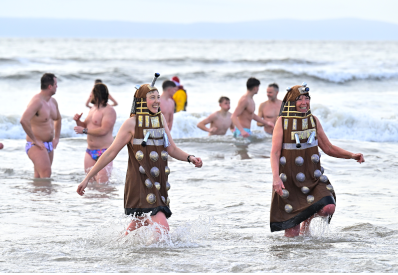 Group of people enjoying a new year dip in the sea